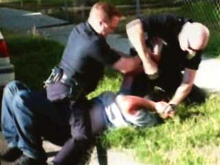 cops beating man